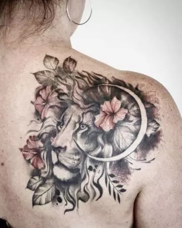 Lion and moon tattoo on the shoulder