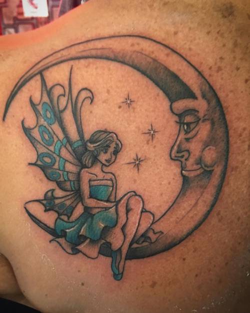 Fairy on a half moon tattoo