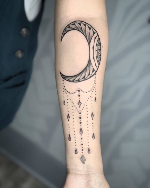 Embellished crescent moon tattoo