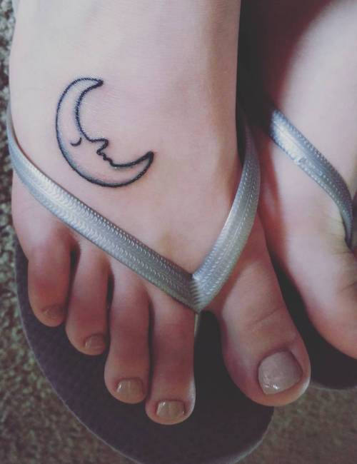 Personified crescent moon tattoo