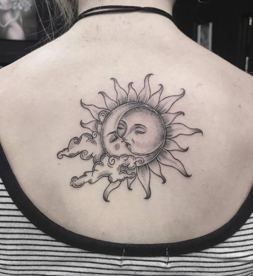 Sun and moon tattoo on the back