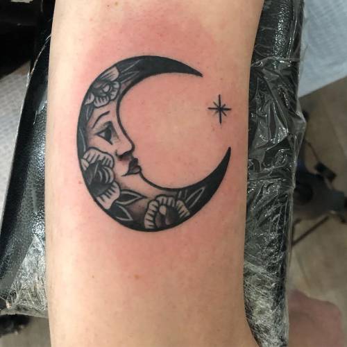 Crescent moon with star tattoo