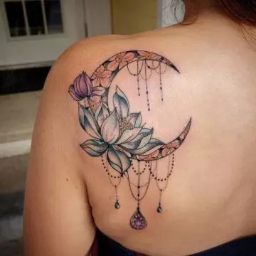 Lotus moon tattoo on the back of shoulder