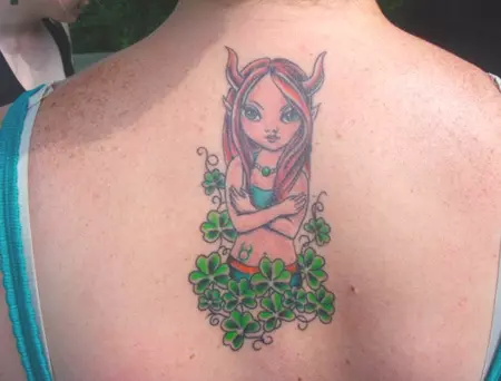 A fairy with bull horns tattoo