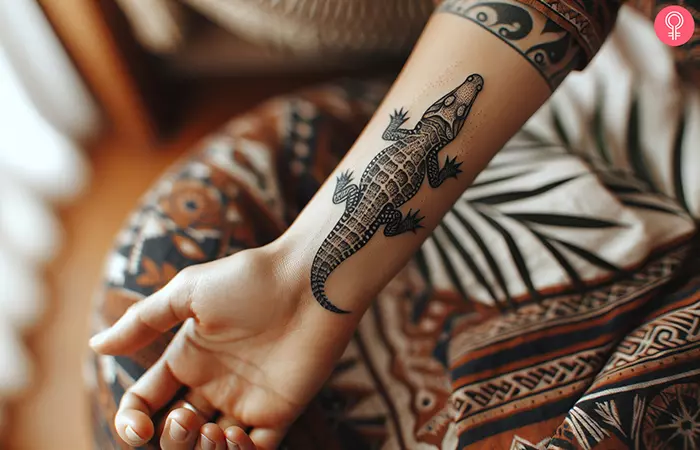 A crocodile tattoo on the forearm