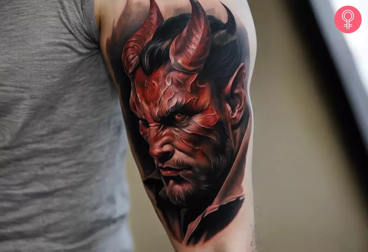 A devil tattoo on the upper arm