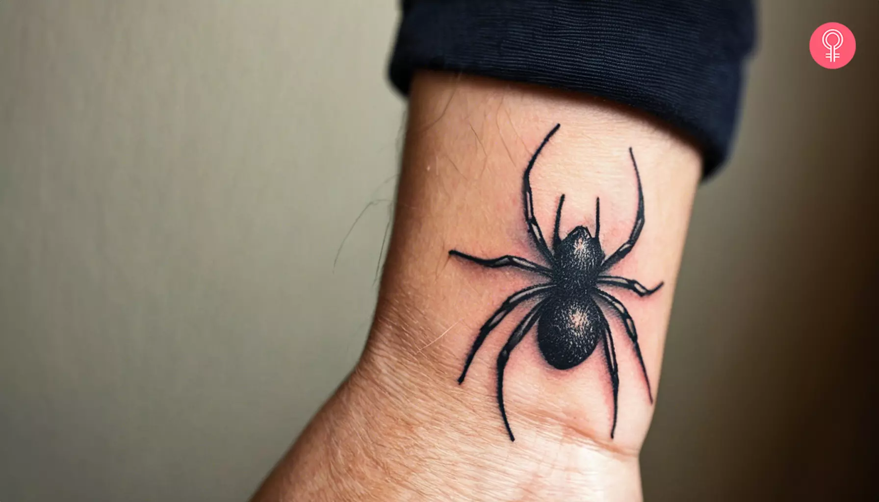 A man with a spider wrist tattoo