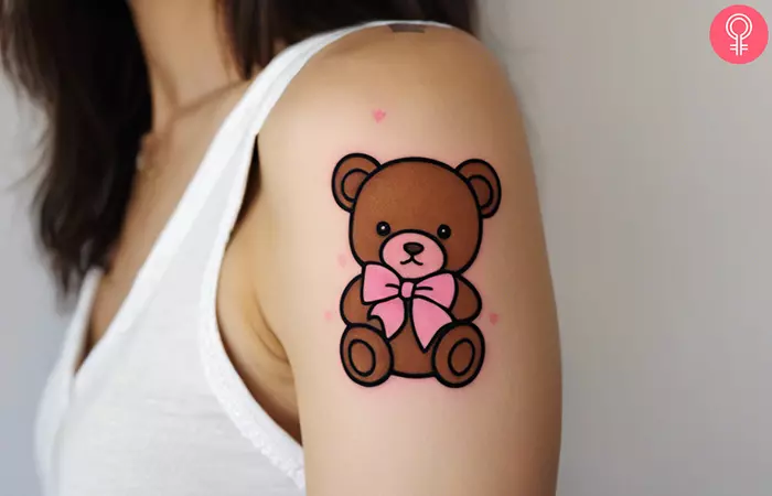 A stuffed animal tattoo on the upper arm