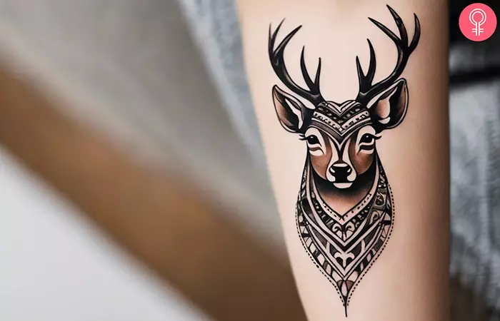 An animal forearm tattoo of a deer