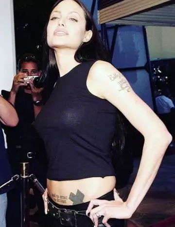 Meaning of Angelina Jolie's cross tattoo on shoulder