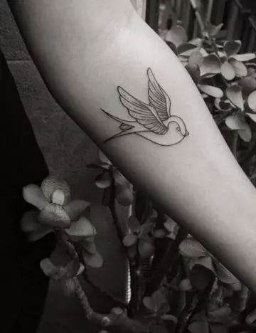 Small bird tattoo design on hand