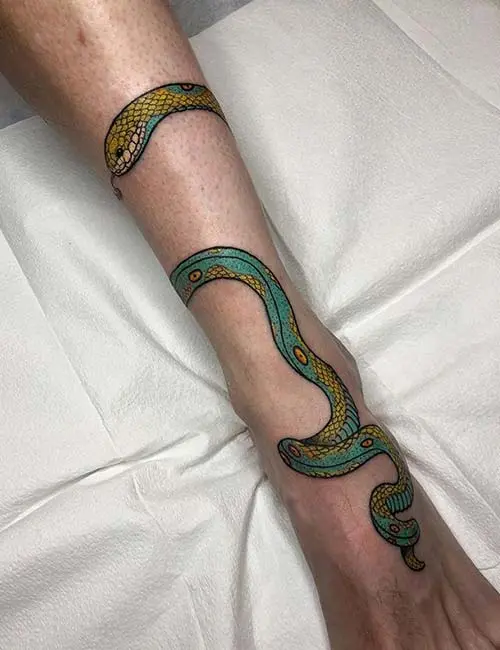 Bold snake ankle tattoo