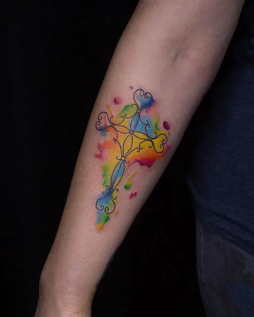 Colorful cross tattoo