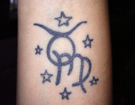 Taurus tattoo with another zodiac tattoo