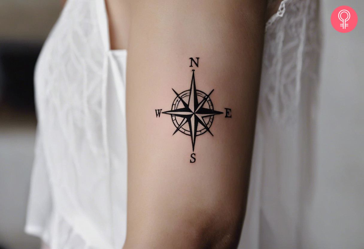 A woman with a compass tattoo on her arm