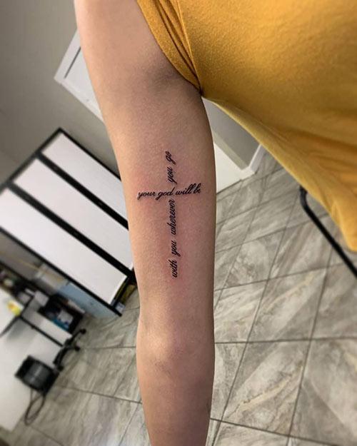 Cross script tattoo