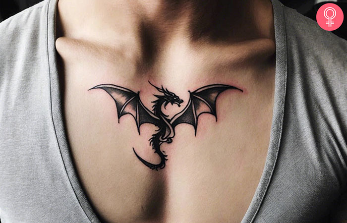 A man with a dragon tattoo on his sternum.