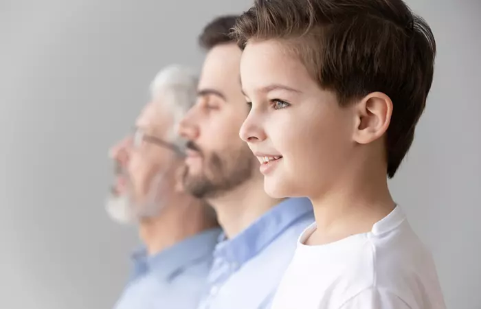 Boy with father and grandfather showing concept of genes