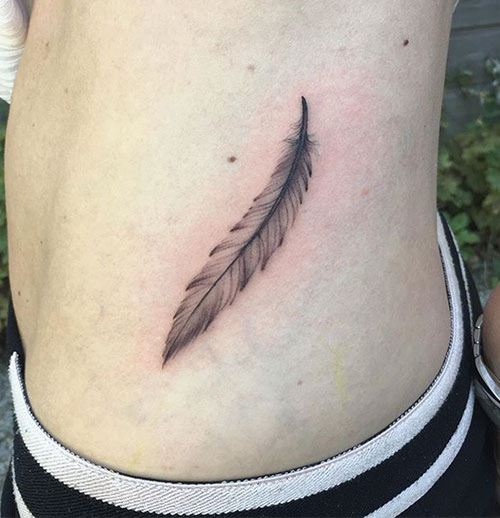 Small feather tattoo design