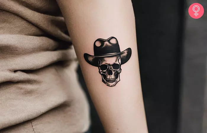 Dainty skull tattoo on the forearm