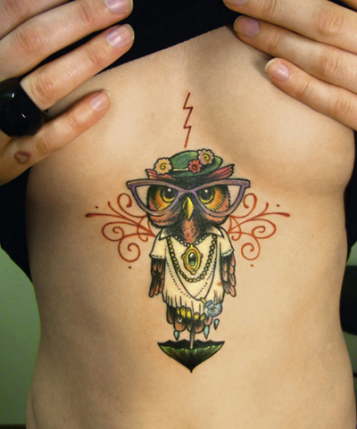 Funny owl breast tattoo