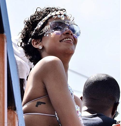 Rihannas Gun Tattoo  What Do Rihannas Tattoos Mean Heres a Quick Guide   POPSUGAR Beauty Photo 18