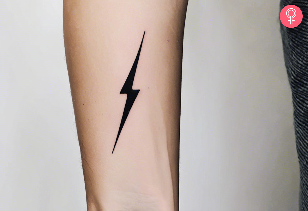 A woman with a lightning bolt tattoo on her forearm