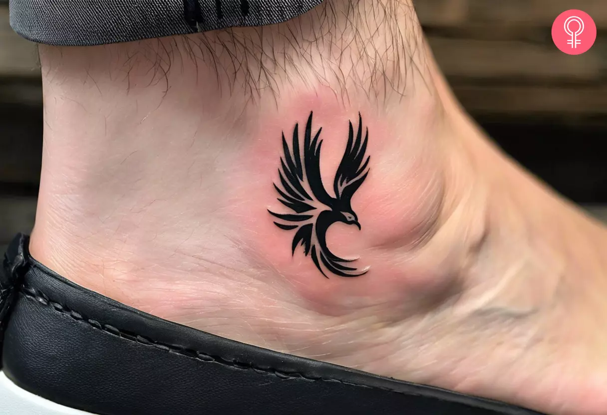 Man with phoenix ankle tattoo on his ankle