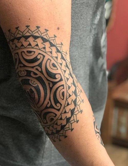 Mandala Maori tattoo design on elbow