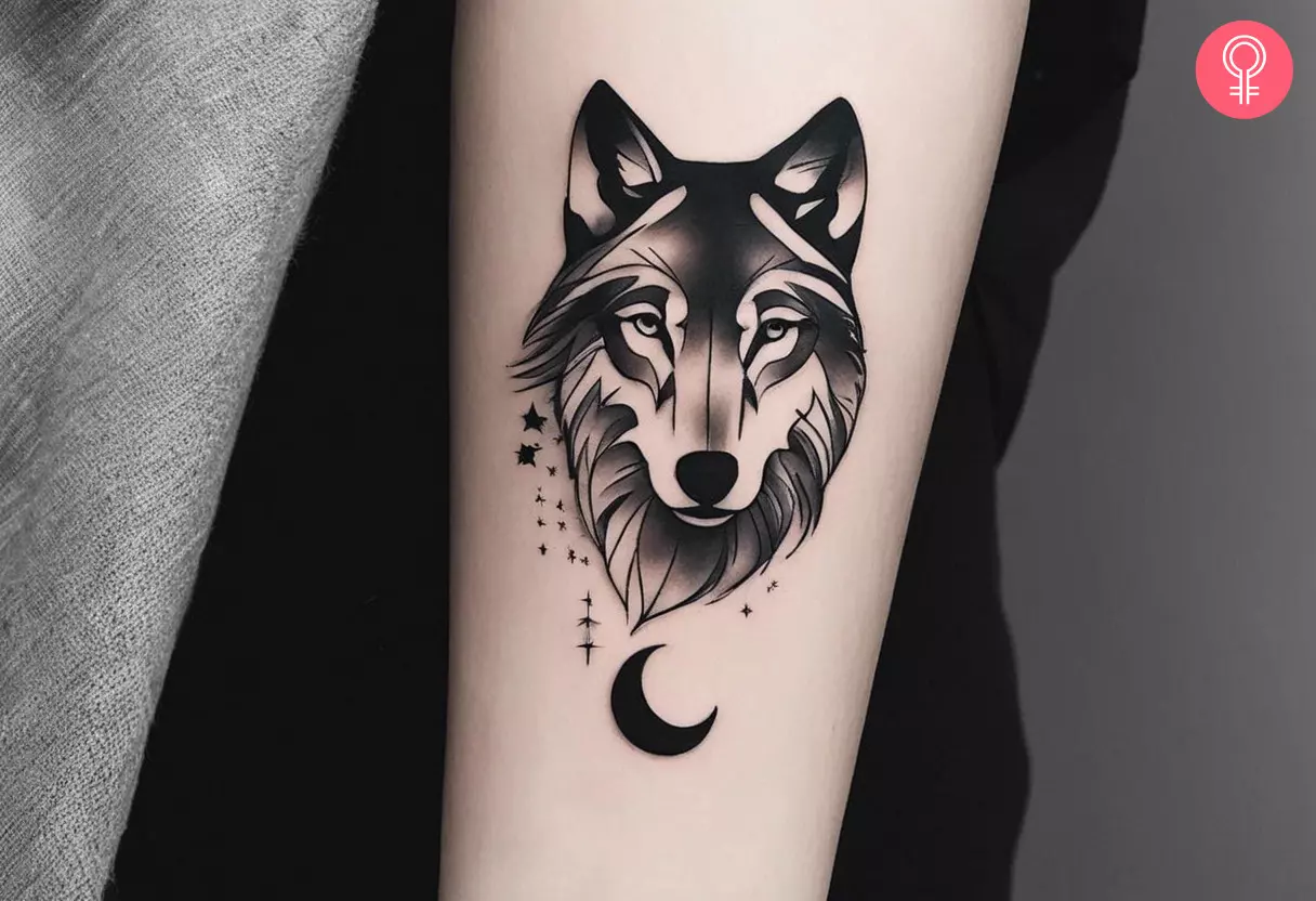 A wolf with a moon tattoo on the forearm