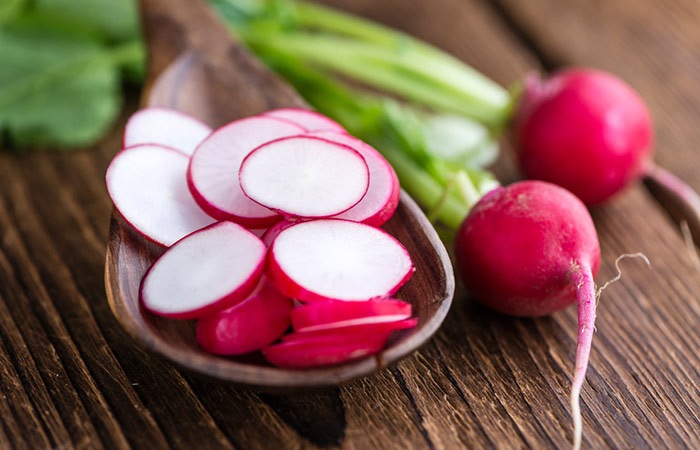 Sliced radish in a wooden bowl