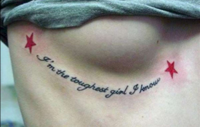 Quotation breast tattoo