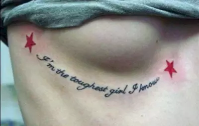 Quotation breast tattoo