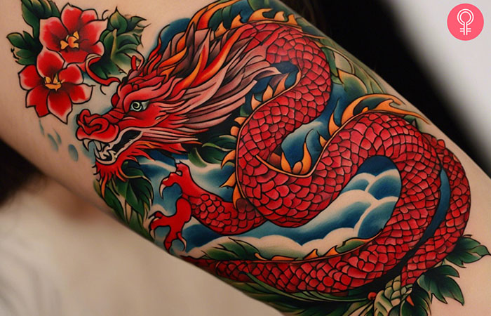 A woman with a red dragon tattoo design.