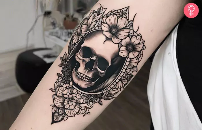 A simple skull tattoo on the arm
