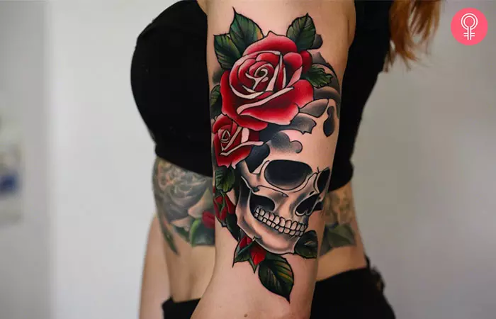 Skull and roses tattoo on the bicep