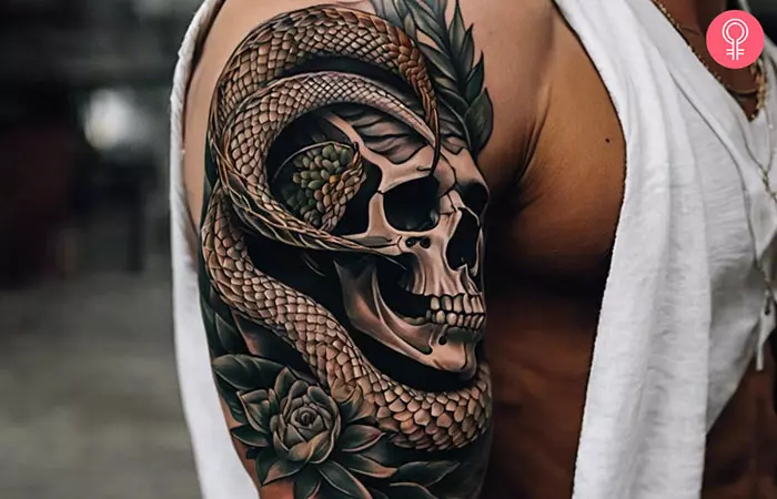 Skull and snake tattoo on the upper arm