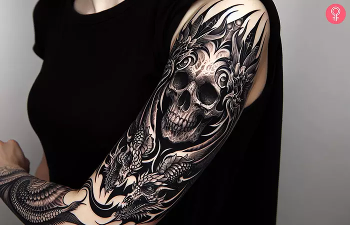 Skull and dragon tattoo sleeve on the arm