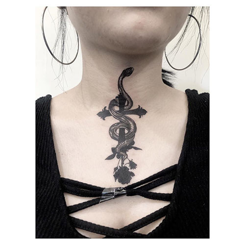 Snake on a cross tattoo