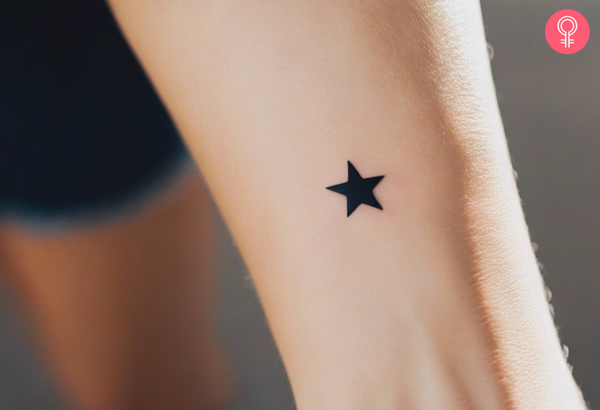 A woman with a star tattoo on her wrist