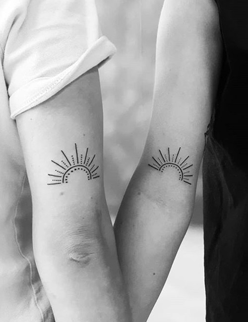 Small Sun tattoo design on back of arms