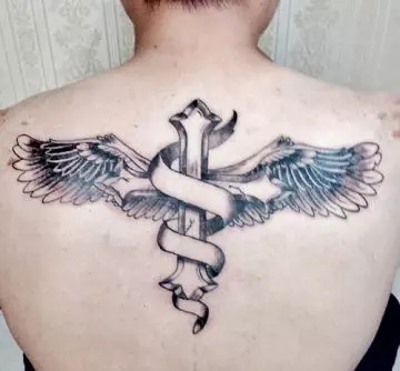 Winged cross tattoo on the back