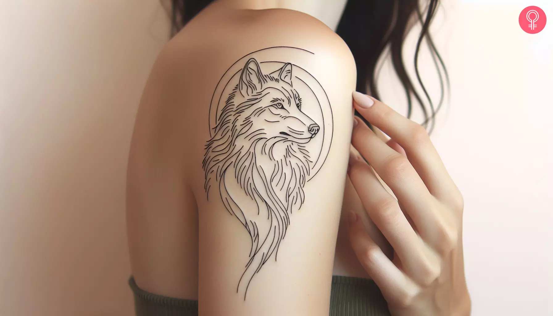 An outline wolf tattoo on the upper arm.