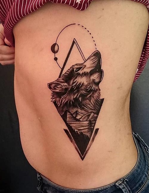 Wolf tattoo on the side abdomen