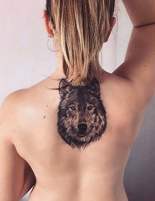 Wolf tattoo on the upper back