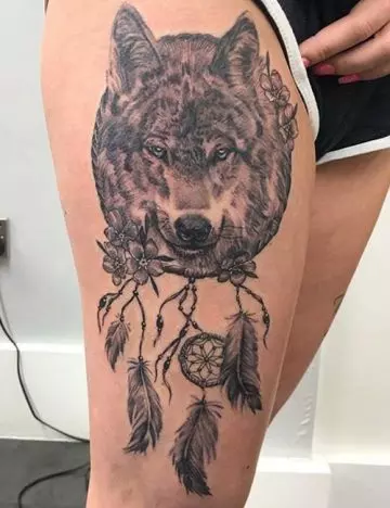 Wolves with dreamcatcher tattoo