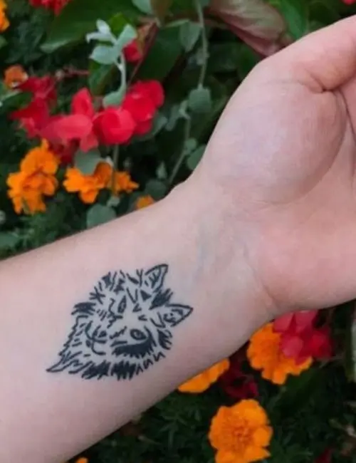 Wolf tattoo design on the wrist