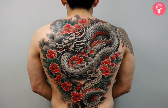 A man with a Yakuza dragon tattoo on his back.