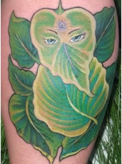 Leaves and floral Ganesh tattoo