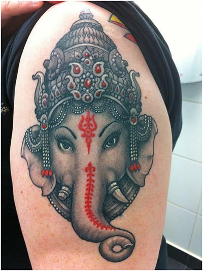 Black white and red Ganesh head tattoo